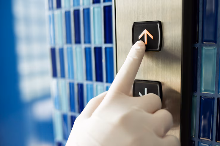 gloved-hand-pressing-elevator-button-prevent-coronavirus-contamination_53876-94742